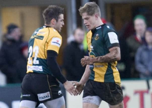 INSPIRATION - Will Hooley (right) is replaced by Stephen Myler during Saturday's win over Saracens (Picture: Linda Dawson)