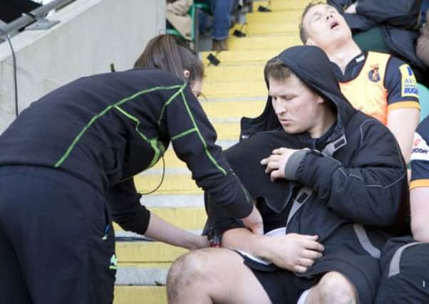 Dylan Hartley is treated after suffering a shoulder injury in last Saturday's defeat to Leicester (picture: Linda Dawson)