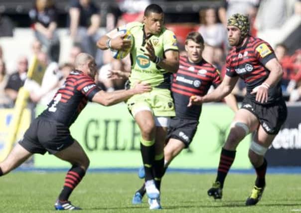 SETBACK - Luther Burrell finds himself outnumbered during Sunday's defeat at the hands of Saracens (Picture: Linda Dawson)