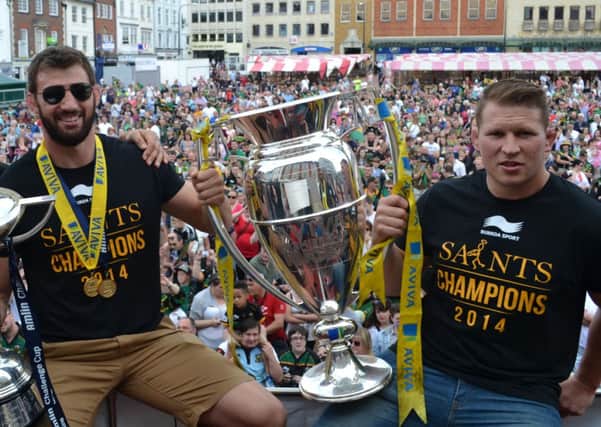 LEADING LIGHTS - Tom Wood (left) and Dylan Hartley show off the Aviva Premiership trophy during last Sunday's victory parade through Northampton