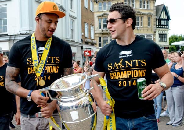 HAPPY MAN - Courtney Lawes (left) and Phil Dowson enjoy the Saints victory parade in Northampton last weekend