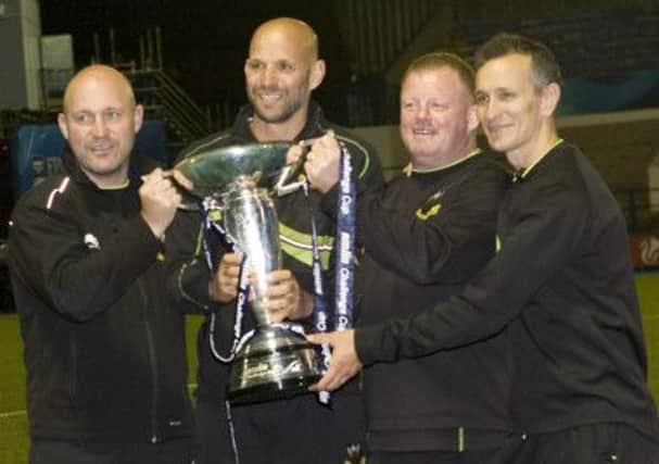 WINNING TEAM - Alex King (left) with the Saints coaching team of Jim Mallinder, Dorian West and Alan Dickens (Picture: Linda Dawson)