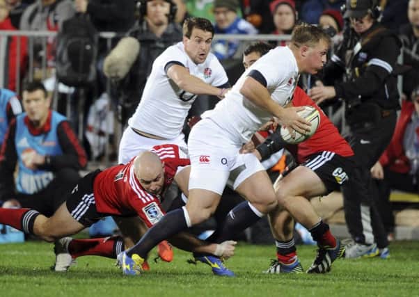 ON THE CHARGE - Englands Alex Waller slips a tackle of Crusaders Willi Heinz, with Lee Dickson in support