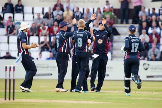 The Steelbacks celebrate after taking a Durham wicket in the rain-reduced game at the County Ground