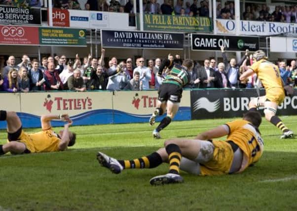 BATTERED AND BRUISED - George North flies over for a try during May's hammering of Wasps at Franklin's Gardens. Saints will find the Adams Park outfit a tougher proposition on Sunday (Picture: Linda Dawson)