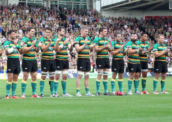 EMOTIONAL MOMENT - the Saints players join in the minute's applause for Luis Ghaut ahead of Saturday's win over Bath (Picture: Sharon Lucey)
