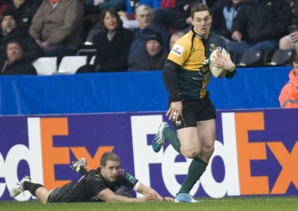 HAPPY MEMORY - George North powers his way to the line for his try in the win at Ospreys last season (Picture: Linda Dawson)