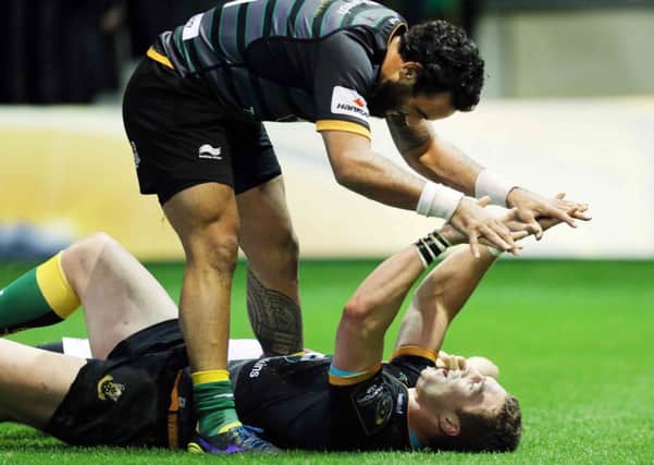 PERFECT 10 - Kahn Fotuali'i congratulates Saints' star man George North on his stunning fourth try against Ospreys (Pictures: Kirsty Edmonds)
