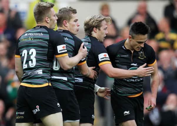 Tom Collins is congratulated on the first of his two tries against Newcastle in the LV= Cup (pictures: Sharon Lucey)