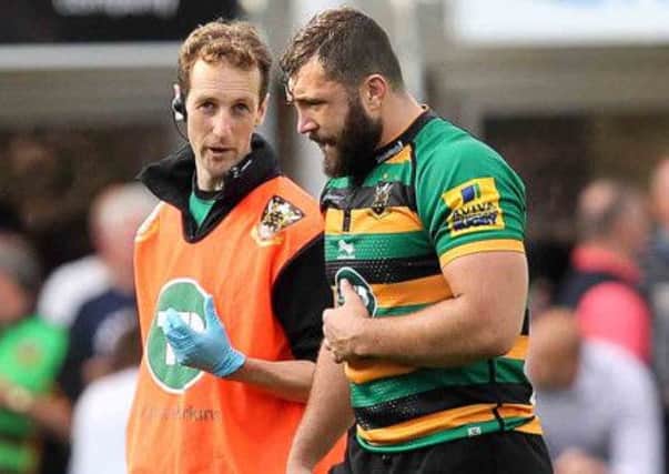 ON HIS WAY BACK - Alex Corbisiero leaves the field after being injured in the match against Bath back in September