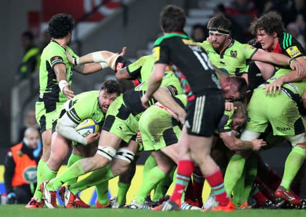 IN ACTION - Alex Corbisiero (second left) carries the fight against Harlequins (picture: Sharon Lucey)