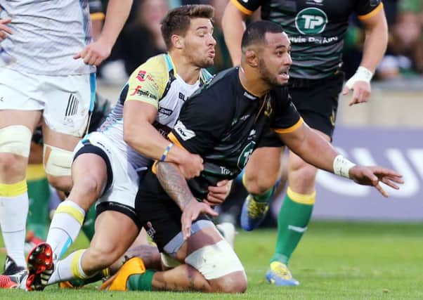 THREAT - Rhys Webb gets to grips with Samu Manoa in Ospreys' defeat to Saints last year