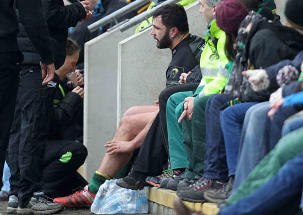 SITTING IT OUT - Alex Corbisiero receives treatment after being forced off the pitch on Saturday (Picture: Sharon Lucey)