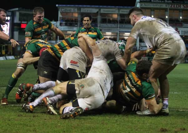 TOUGH BATTLE - Alex Waller (left) looks on as Sam Dickinson scores his try for Saints in Friday's win over London Irish (Picture: Sharon Lucey)