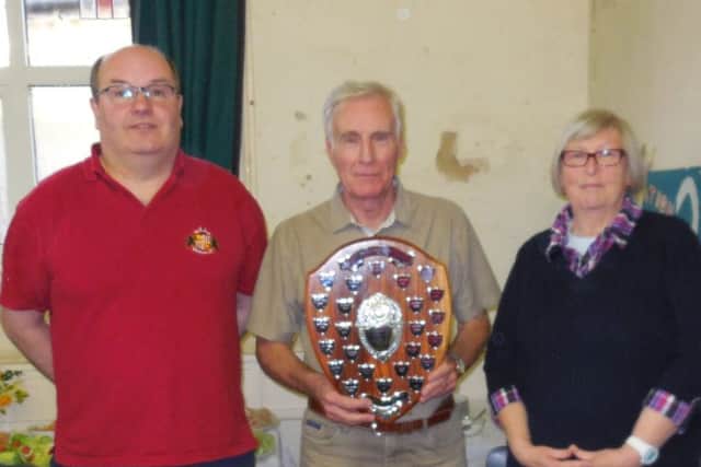Murray Coleman (middle) from the Rothwell team picks up his award from judges Mike Chester and Joy Pluckrose
