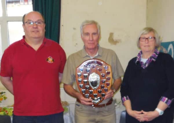 Murray Coleman (middle) from the Rothwell team picks up his award from judges Mike Chester and Joy Pluckrose