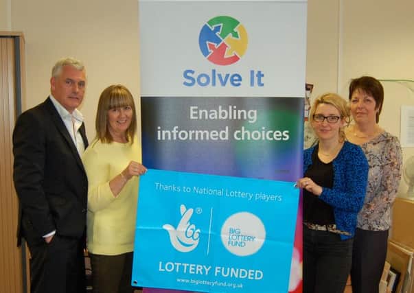 Chair of trustees, Kevin Shapland, with Solve It staff