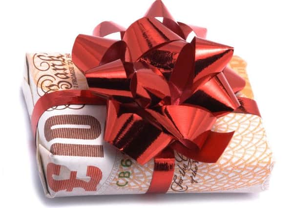 Gift money, birthday money gift-wrapped £10 note. iStock image