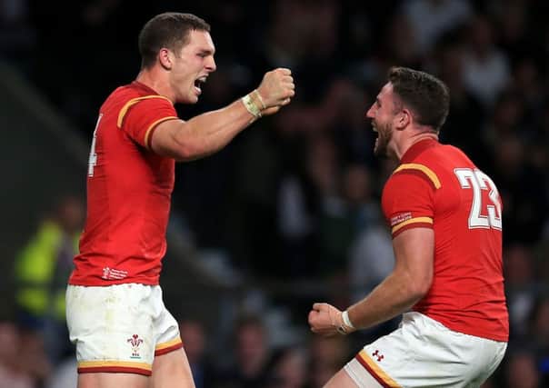 George North celebrates Wales' win against England with Alex Cuthbert