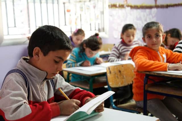 Girls are outperforming boys in the three R's says a new report