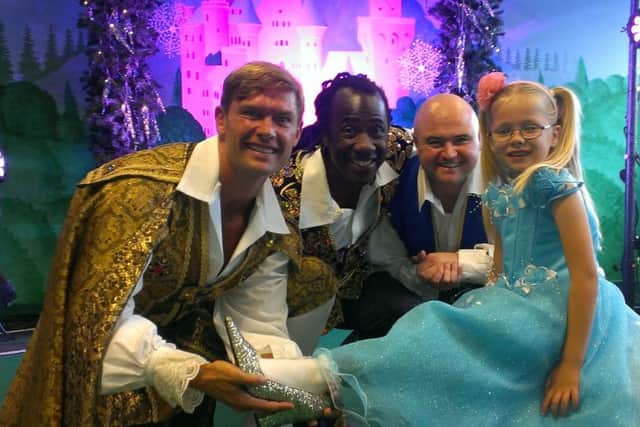 Pantomime stars John Partridge, Sid Sloane and Danny Posthill meet one of their fans at the launch of Cinderella coming to the Royal and Derngate.