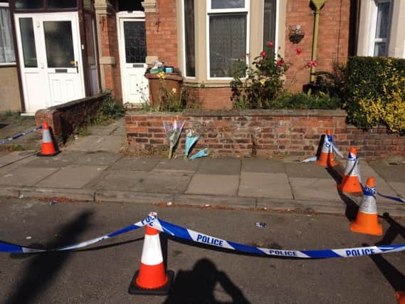Flowers have been left outside a house where a man died in Northampton