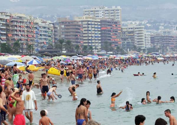 The scene on the beach at Fuengirola on the Costa Del Sol in Spain, as new research suggests that the proportion of people not going on at least one holiday a year is rising. Photo: Stefan Rousseau/PA Wire