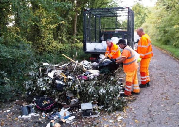 Rubbish dumped near Silverstone earlier this month being cleared by South Northamptonshire Council workers