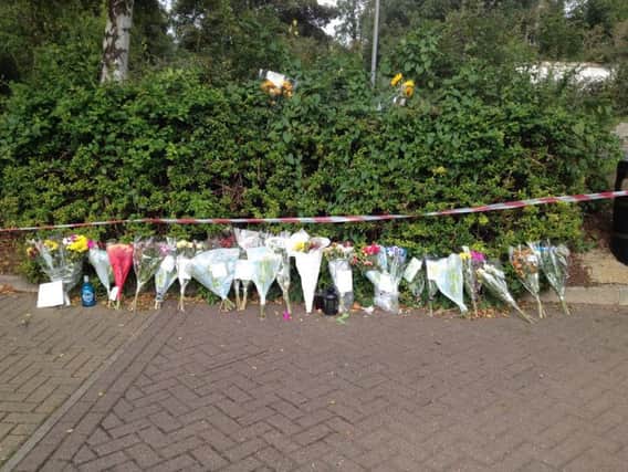 Flowers left in memory of Lorenzo Gallucci in the Splash car park in Rushden