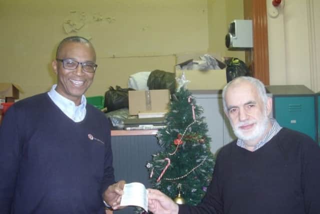 Paul Chambers (right) of the Daylight Centre, receives a cheque from Sam Chambers, of York Ward and Rowlett