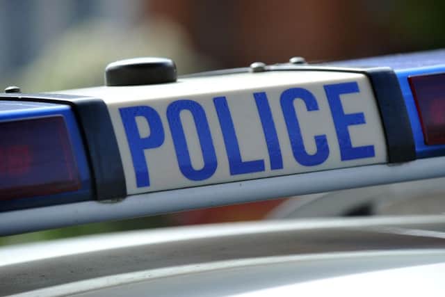 A man was thrown to the ground and kicked by three teenage boys who demanded cigarettes and money from him