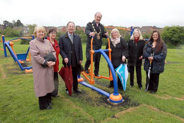 Town mayor Ken Harrington officially opens an outdoor gym, as part of a drive to reduce anti-social behaviour on Wellingboroughs Queensway estate. ENGNNL00120130515133723