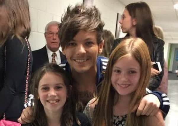 Hannah Curry and Bronte Irvine backstage with Louis Tomlinson from One Direction in Birmingham last year