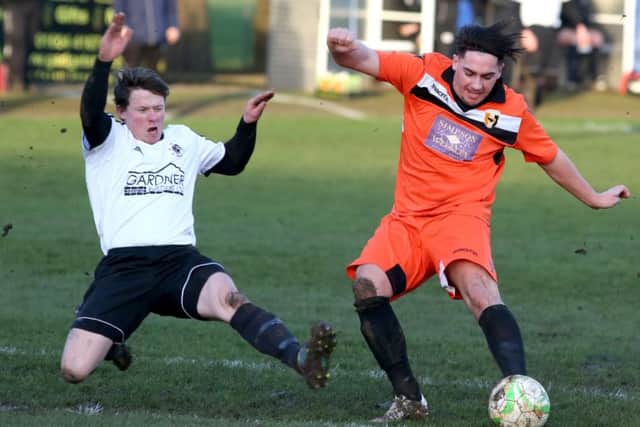 Action from Rushden & Higham United's 4-1 success over Bugbrooke in Division One