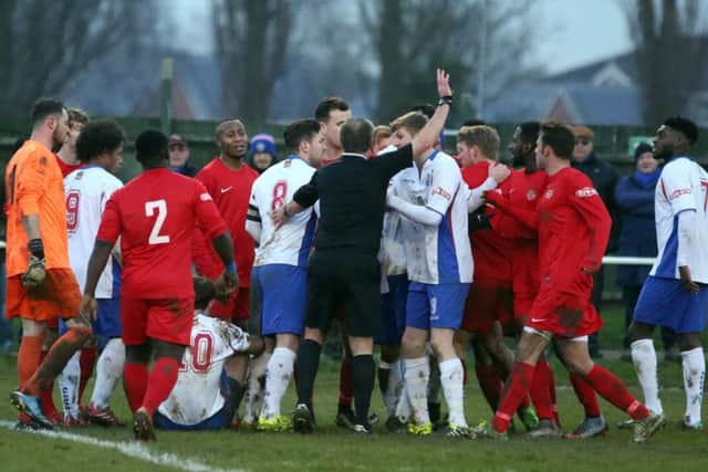 Players from both sides get involved following a challenge on Tom Lorraine that saw North Greenford United's Jessy Yoboue sent off