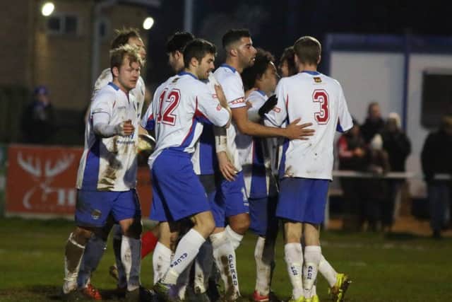 AFC Rushden & Diamonds' players celebrate one of their eight goals