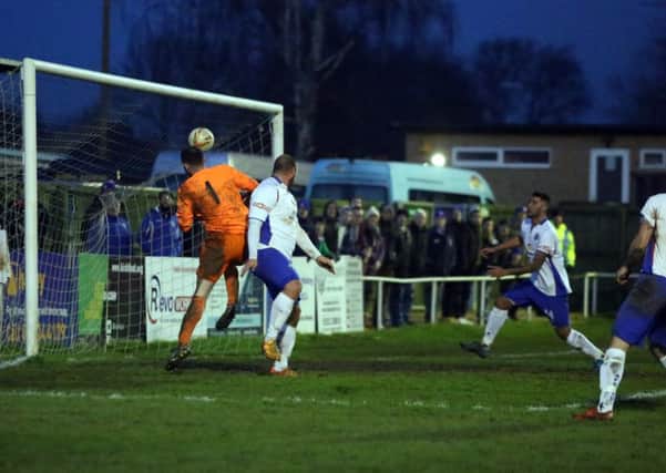 Liam Dolman heads home AFC Rushden & Diamonds' sixth goal in the 8-1 demolition of North Greenford United. Pictures by Alison Bagley