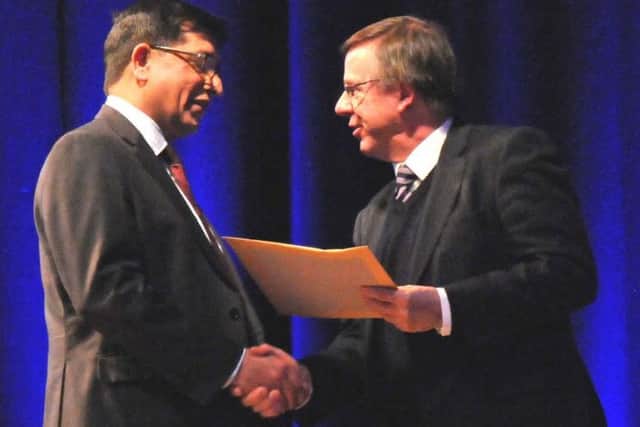 Kettering General Hospitals Consultant in Respiratory Medicine, Dr Nasir Siddique, being presented with his award by Prof Nicholas London, Head of Leicester Medical School.