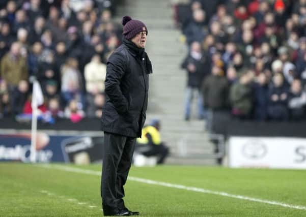 DISAPPOINTING RESULT - Cobblers boss Chris Wilder watches his team lose 3-0 at stadiummk (Pictures: Kirsty Edmonds)