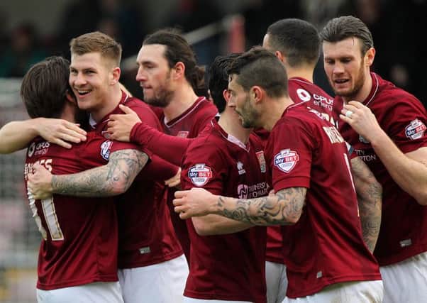 GREAT START - the Cobblers players celebrate James Collins' opening goal in the win over Morecambe (Pictures: Sharon Lucey)