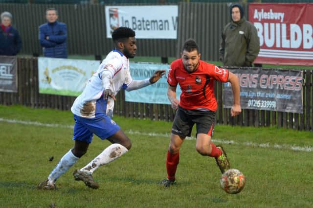 Shawn Richards challenges Aylesbury's Aston Goss during AFC Rushden & Diamonds' 4-2 win. Pictures by Jake McNulty