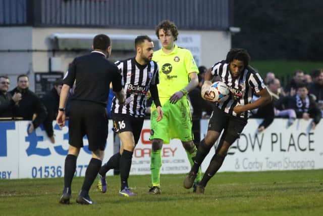 Anton Brown gathers the ball after Greg Mills had pulled a goal back for Corby Town from the penalty spot in the 2-1 loss to Gainsborough Trinity. Pictures by Alison Bagley