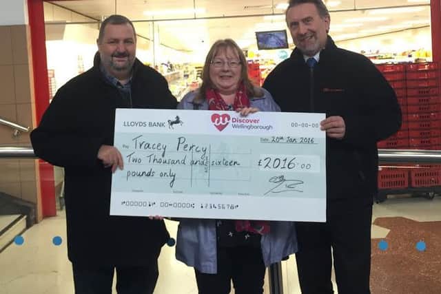 Winner Tracy Percy with her cheque
