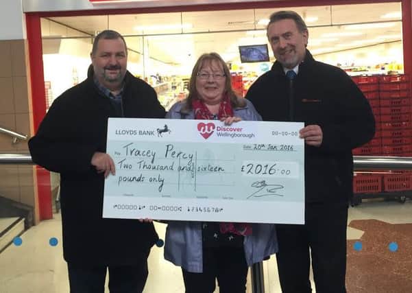 Winner Tracy Percy with her cheque