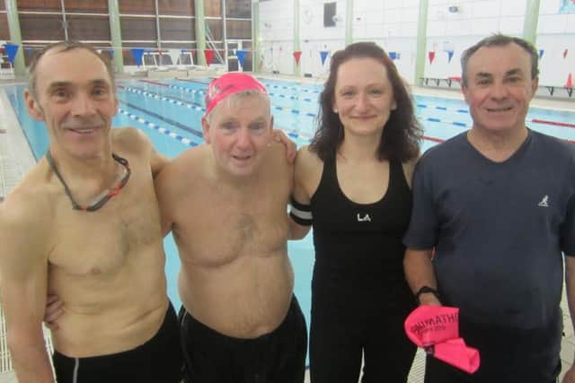 Tom (second from left) with his Swimathon team of Dave, Marketa and Alex at the Waendel Leisure Centre in Wellingborough