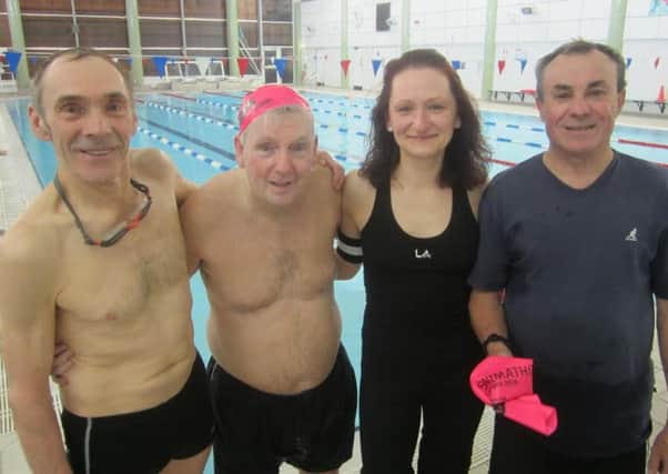 Tom (second from left) with his Swimathon team of Dave, Marketa and Alex at the Waendel Leisure Centre in Wellingborough