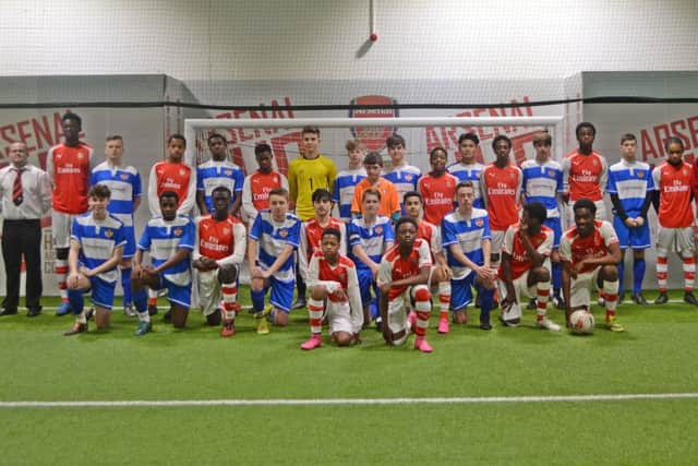 The Kettering Town under-16 players and their Arsenal counterparts pose for the camera ahead of their match last weekend