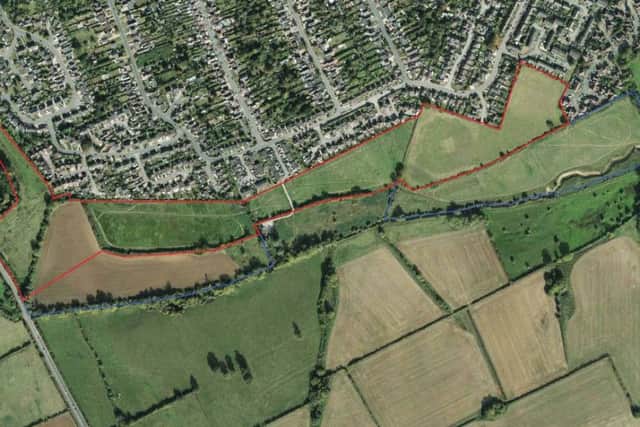 The red lines on this aerial shot show the proposed development site boundary.
