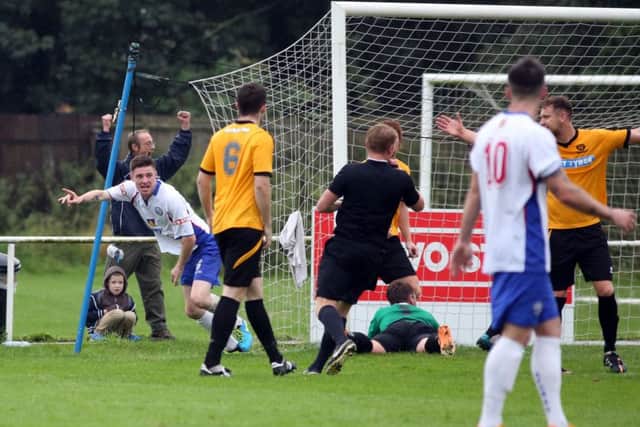 Dan Quigley, pictured celebrating after scoring in the 2-0 home win over Bedford Town in August, has returned to AFC Rushden & Diamonds