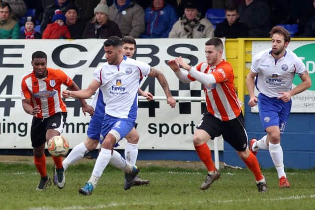 Lewis Leslie, who scored the second goal, gets on the ball for AFC Rushden & Diamonds against Ware on Saturday. Diamonds take on Arlesey Town at home tonight. Picture by Alison Bagley